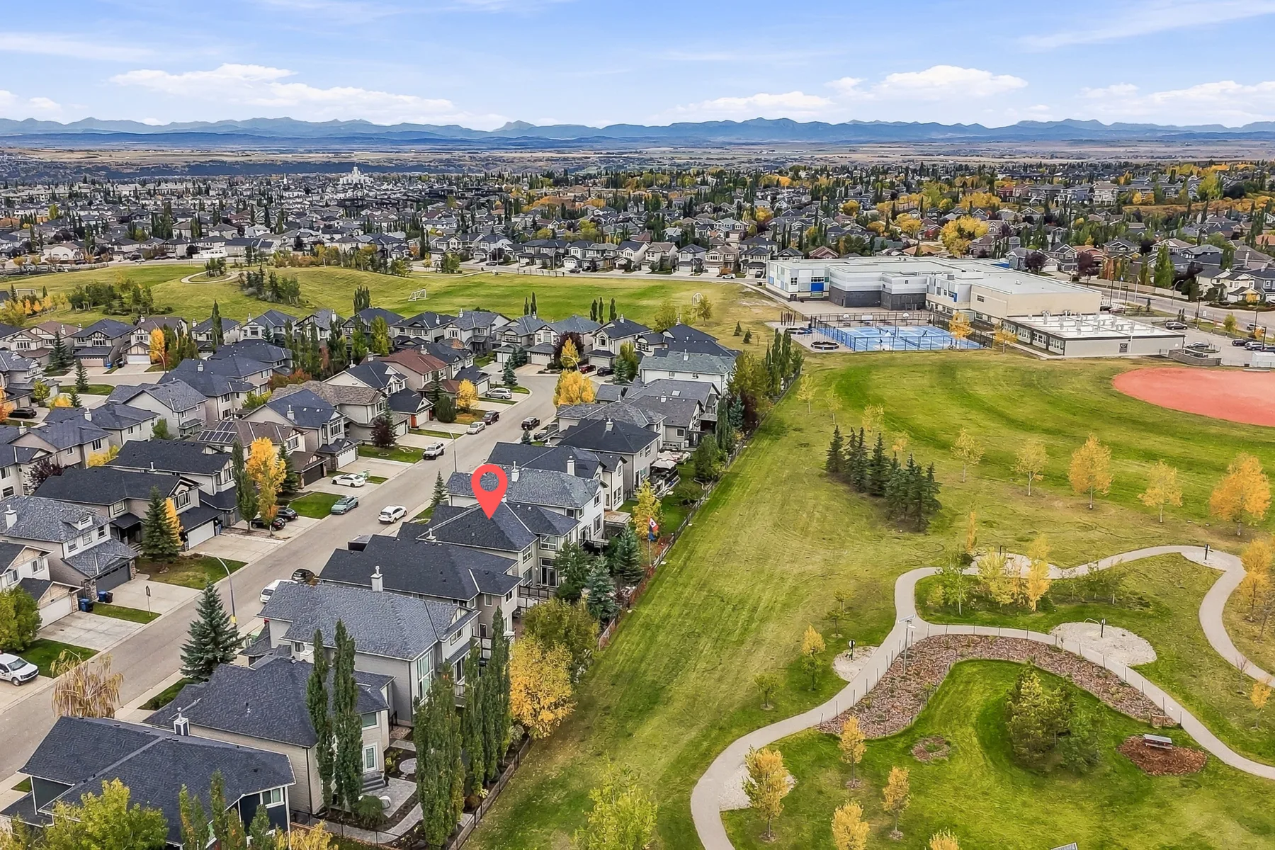 Aerial view of the home and nearby park space